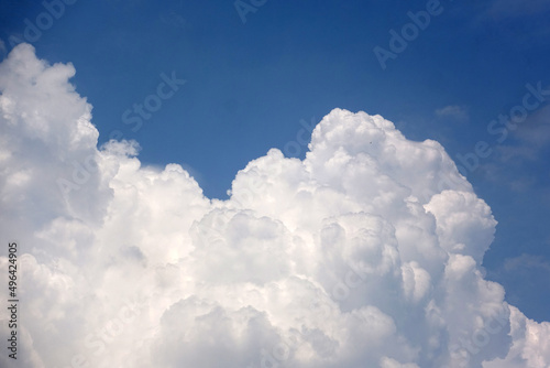 Thick white clouds against a blue sky background 