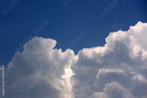 Thick white clouds against a blue sky background 