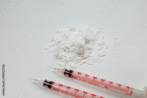 two syringes, white powder