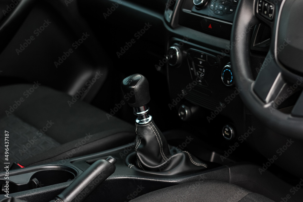 automatic transmission shift selector in the car interior. Closeup a manual shift of modern car gear shifter. 4x4 gear shift