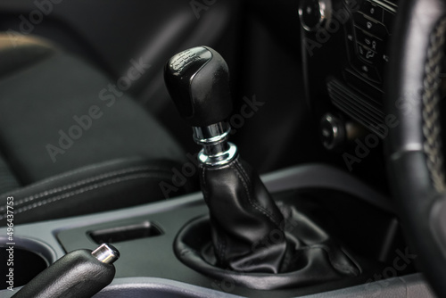 automatic transmission shift selector in the car interior. Closeup a manual shift of modern car gear shifter. 4x4 gear shift