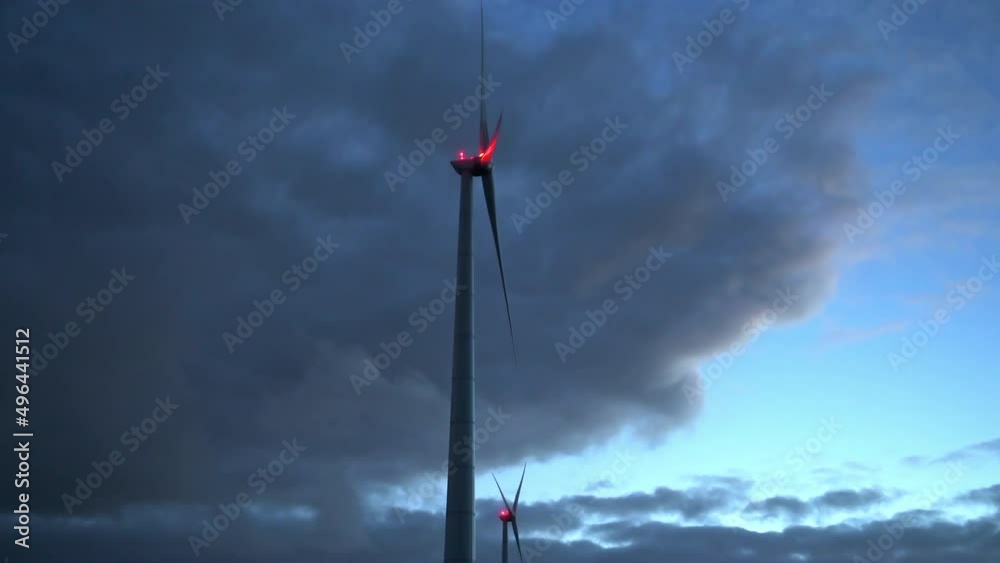 Wind turbine with anti-collision light at dusk, Eemshaven, Netherlands