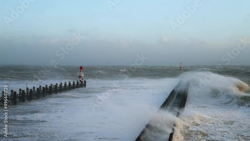 Waves overflowing above pier during storm Eunice, Vlissingen, Netherlands