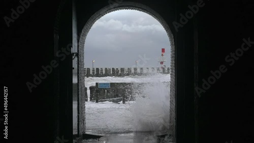 Sea waves on pier during storm called Corrie, Vlissingen, Netherlands