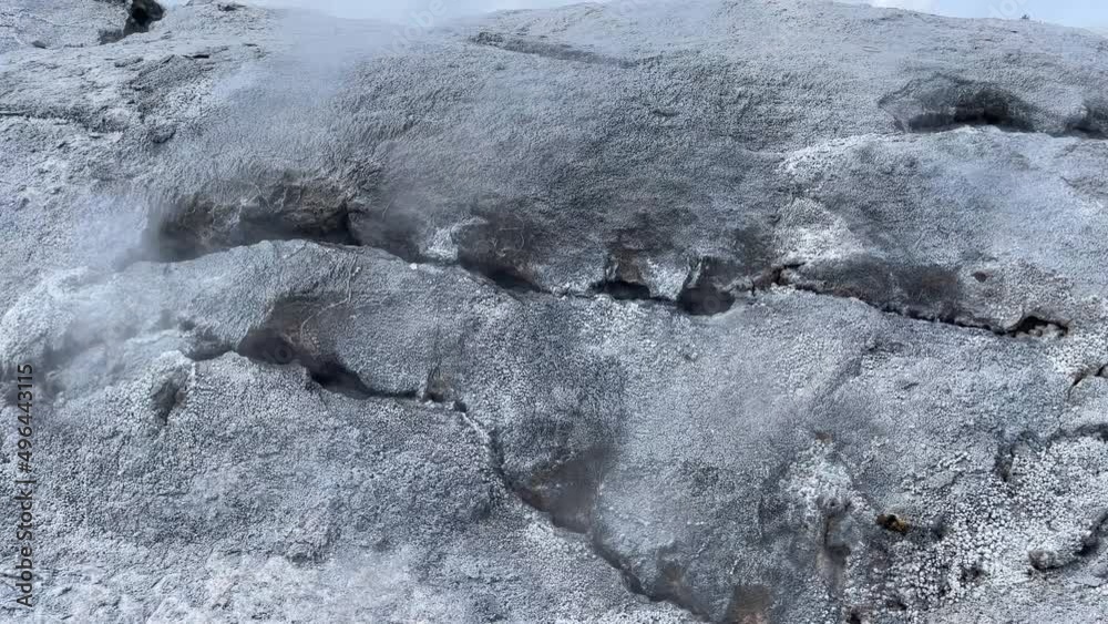 Sulphurous steam escapes from cracks in a rock formation in a geothermal area in Rotorua, New Zealand Sulphurous steam escapes from cracks in a rock formation in a geothermal area in Rotorua, New Zealand