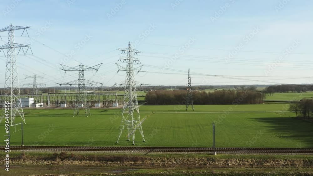 Electricity pylons and train carrying coal, Zwolle, Netherlands
