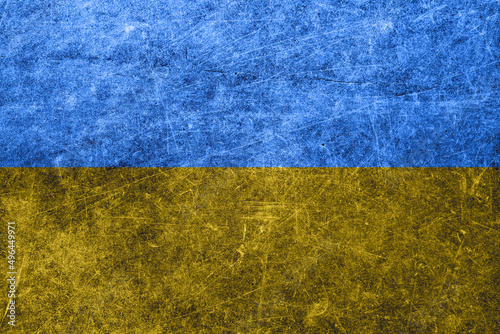 Background with an old shabby wall with the flag of ukraine.