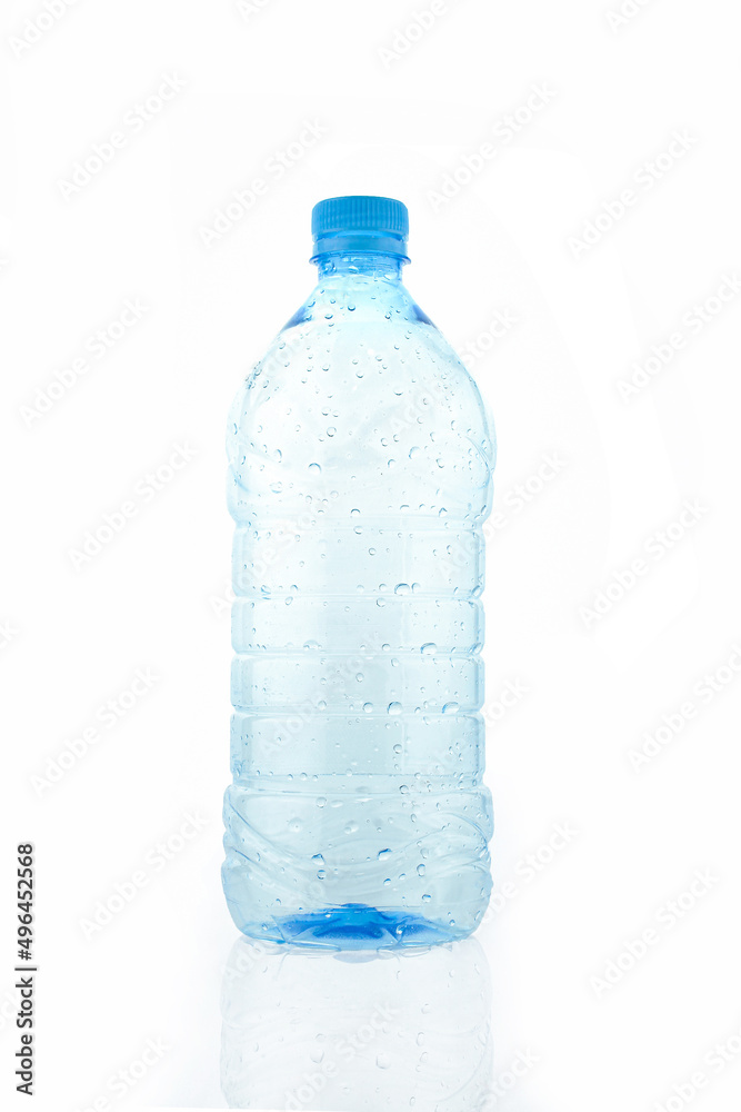 Empty wet transparent bottle isolated on white background. Blue plastic water packaging Empty wet transparent bottle isolated on white background. Blue plastic water packaging