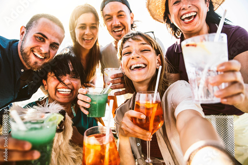 Happy different aged people taking selfie photo holding cocktail glasses outside - Cheerful family having fun together on summer vacation - Summertime lifestyle and happy hour concept