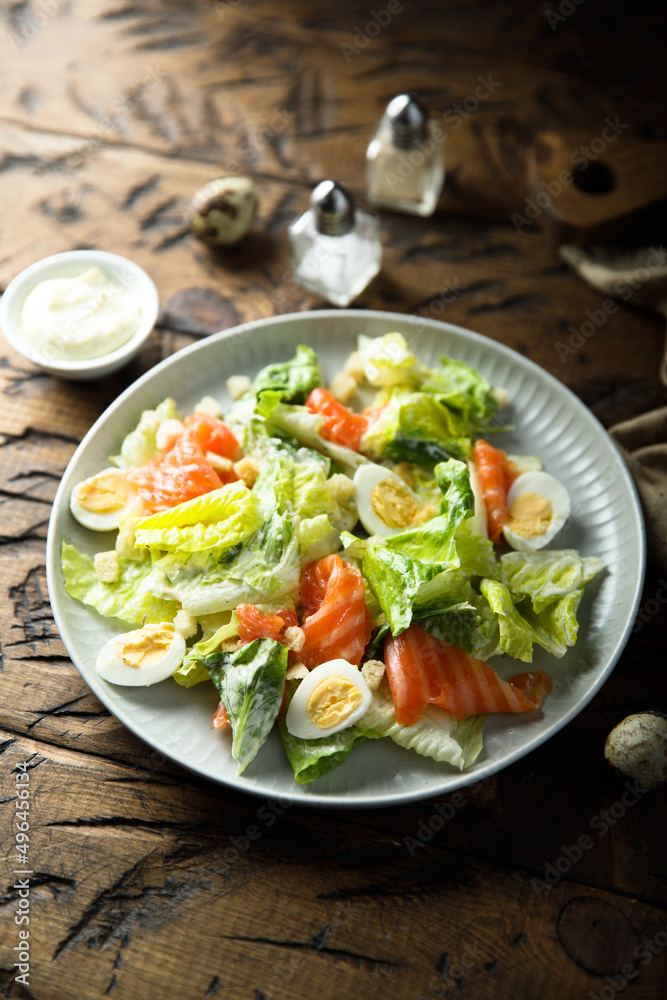 Homemade Caesar salad with salmon