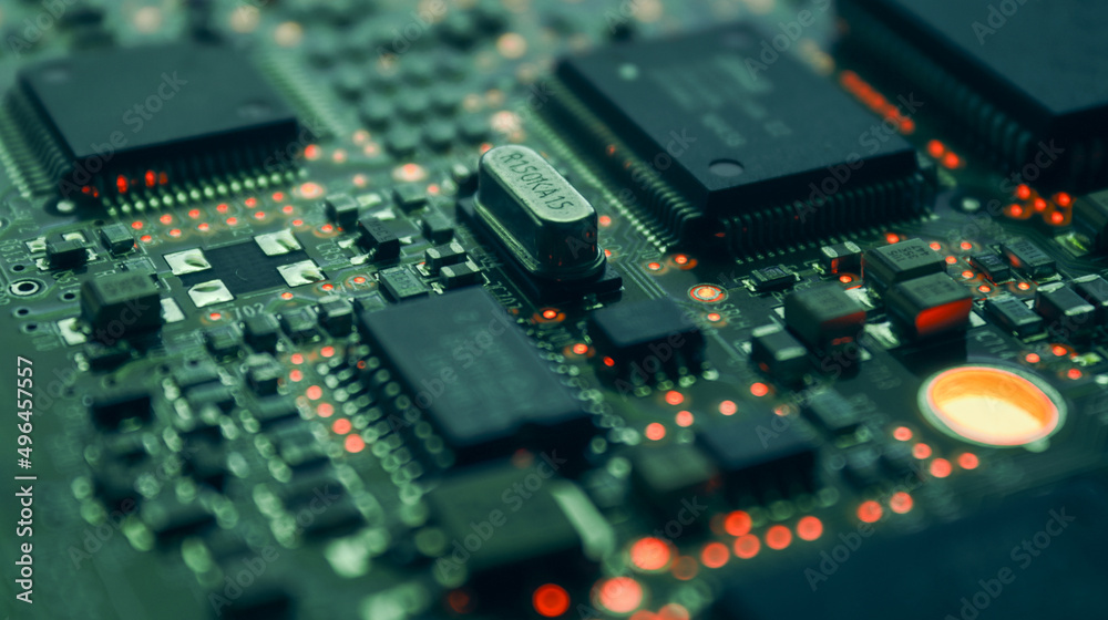 Computer Microchips and Processors on Electronic circuit board. Computer hardware technology. Abstract technology microelectronics concept background. Macro shot, shallow focus. Computer Microchips and Processors on Electronic circuit board. Computer hardware technology. Abstract technology microelectronics concept background. Macro shot, shallow focus.