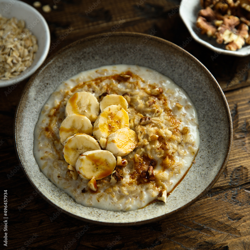 Healthy oatmeal porridge with banana and walnut Healthy oatmeal porridge with banana and walnut