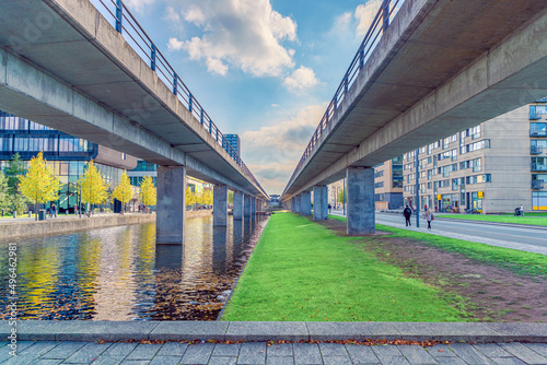 Canvas Print two bridges of the M1 metro subway line and a canal with water near Ørestads Bou