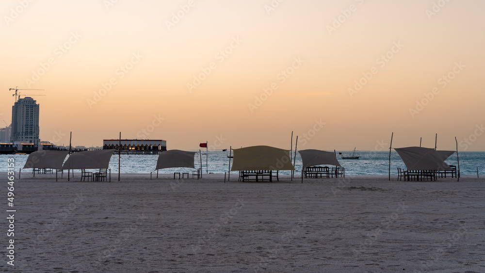 Doha, Qatar - March 03,2022 :Beautiful Katara beach during the early morning with mist in the background.