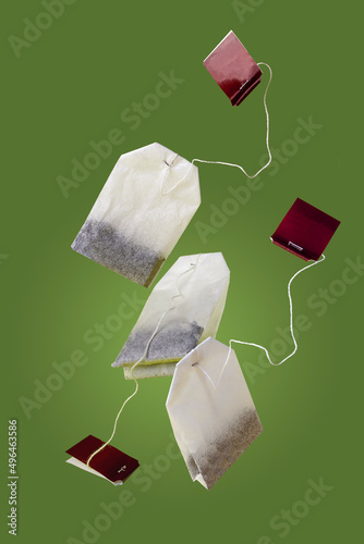 tea bags fly on a green background