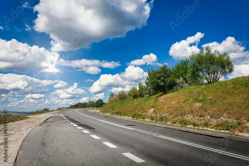 Empty asphalt road and a beautiful blue sky