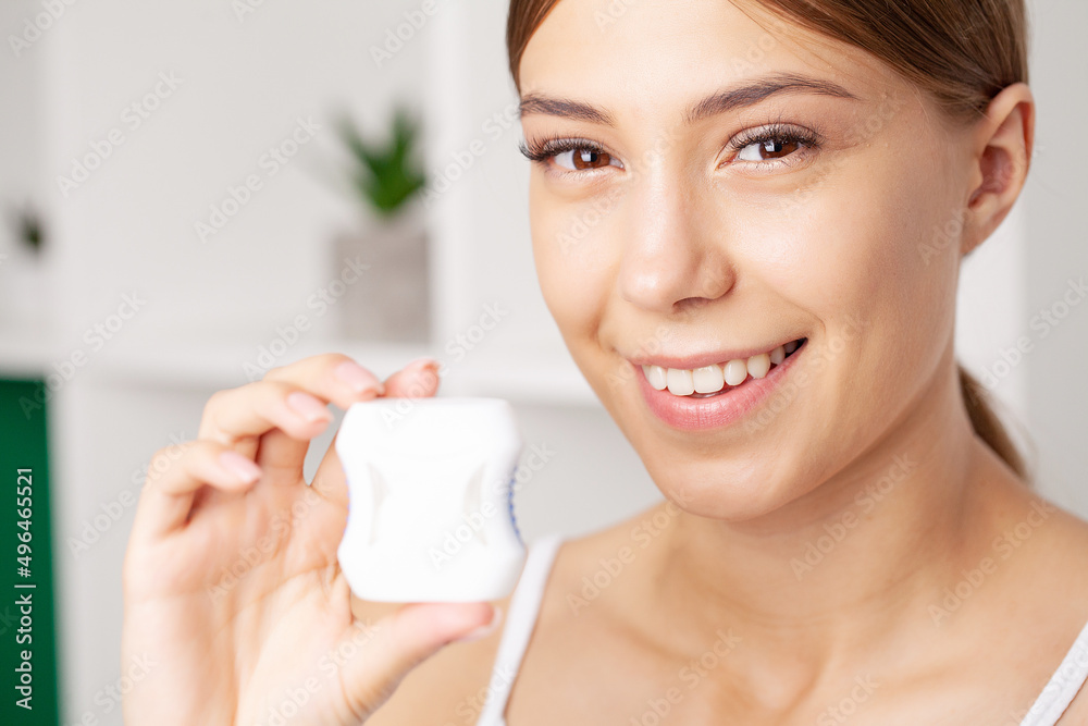 Portrait of cheerful girl using special thread for cleaning teeth. Portrait of cheerful girl using special thread for cleaning teeth.