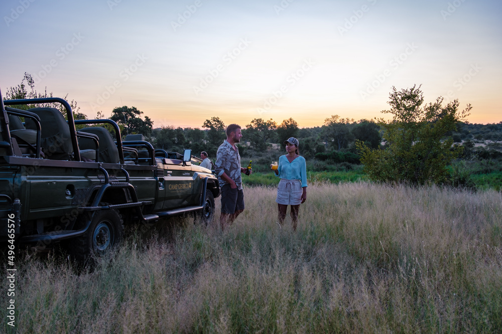 South Africa The Klaserie Private Nature Reserve February , luxury safari car during a game drive, couple men and woman on safari in South Africa.  - obrazy, fototapety, plakaty 