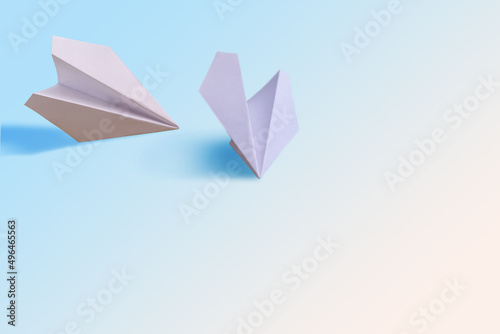 two paper planes on a white background