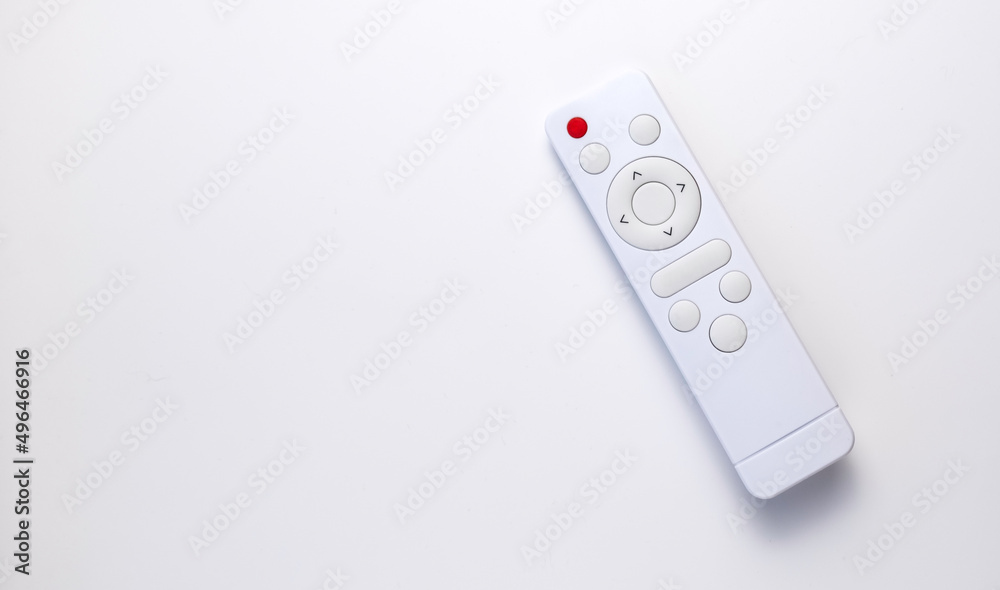 White remote control on a white background. Layout with copy space.