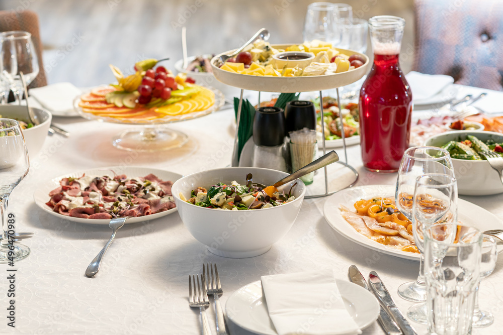 Delicious food on catering wedding buffet for events, white bright background Delicious food on catering wedding buffet for events, white bright background