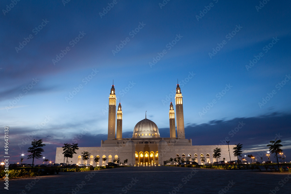A view of Sultan Qaboos Mosque at the blue hour
