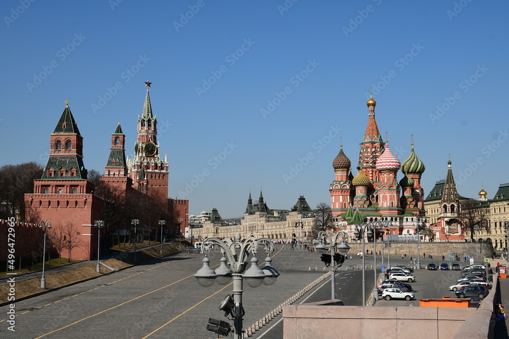 Panoramic view of Red Square, Spasskaya Tower with chimes. St Basil's Church. 03.24. 2022 Moscow, Russia.