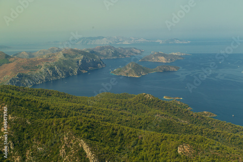 Trees burnt in forest fires of July 2021 in Marmaris resort town of Turkey from helicopter. Beautiful blue bays ans sea