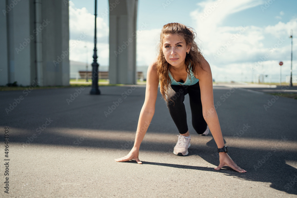 Athletic woman active outdoor workout, stretching and body warm-up, sportswear Athletic woman active outdoor workout, stretching and body warm-up, sportswear
