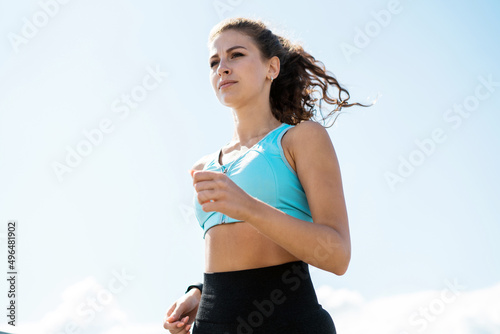 Athletic woman running workout sports cardio