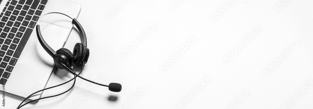 Headset and customer support equipment at call center ready for actively service , Communication support, call center and customer service help desk.for (call center) concept . Headset and customer support equipment at call center ready for actively service , Communication support, call center and customer service help desk.for (call center) concept .