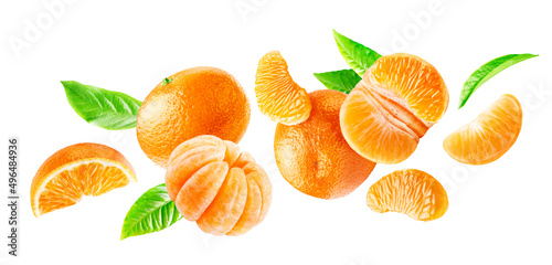Group of flying ripe mandarins whole and peeled with leaves isolated on a white background. photo