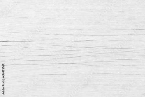 The wood surface looks old, dusty, naturally cracked White color for texture and background