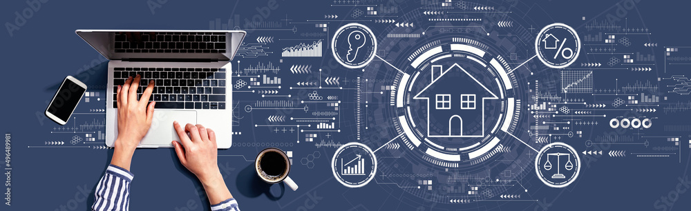 Real estate theme with person using a laptop computer Real estate theme with person using a laptop computer