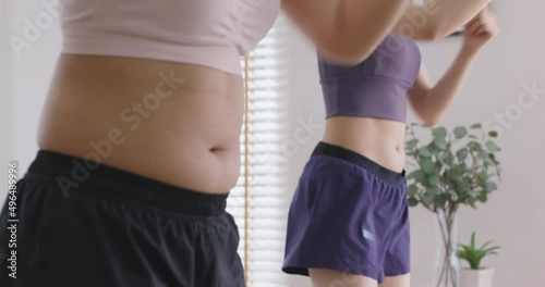 Body positive strong empower on diverse woman shape. Asia people beauty shaming campaign young adult fat slim girl fun play online TV gym class at home enjoy diet loss weight on big arm, thick belly.