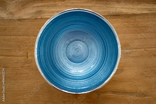 Blue silver italian glass bowl close up on wood