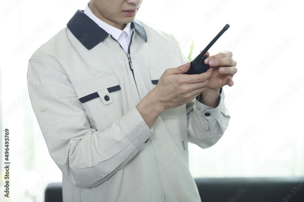 Worker using walkie talkie in office Worker using walkie talkie in office