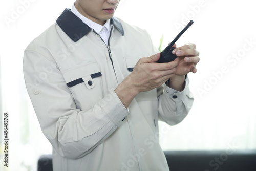 Worker using walkie talkie in office