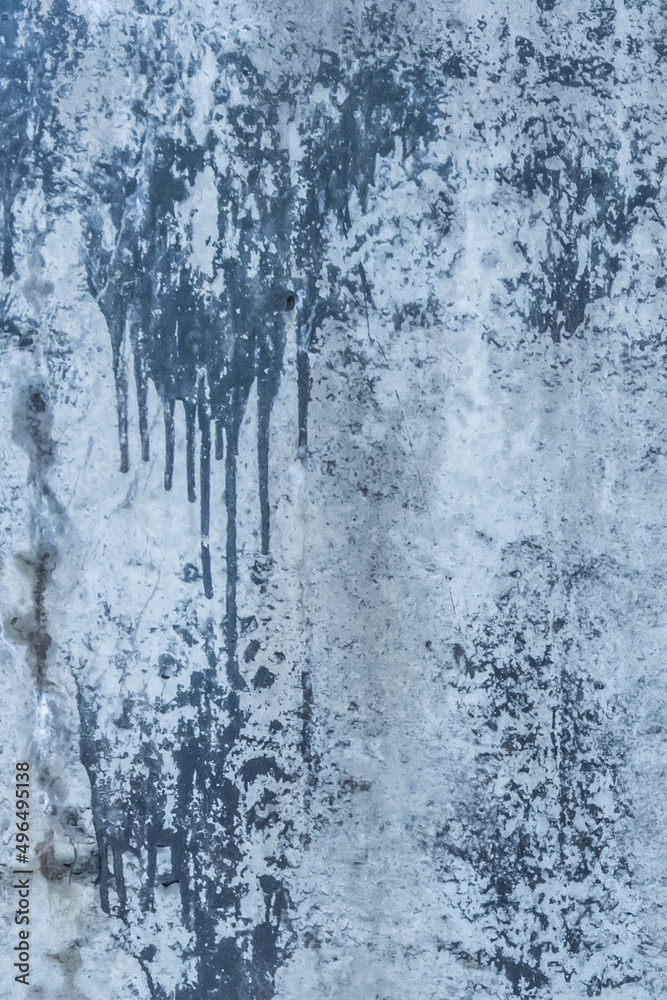 Blue painted concrete surface old stained paint wall texture spilled cement streaks background Blue painted concrete surface old stained paint wall texture spilled cement streaks background