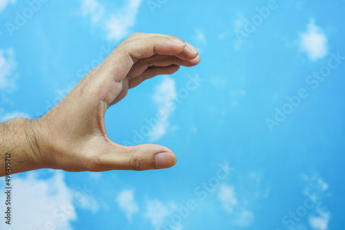 hand symbol isolated from sky background. concept of sign language