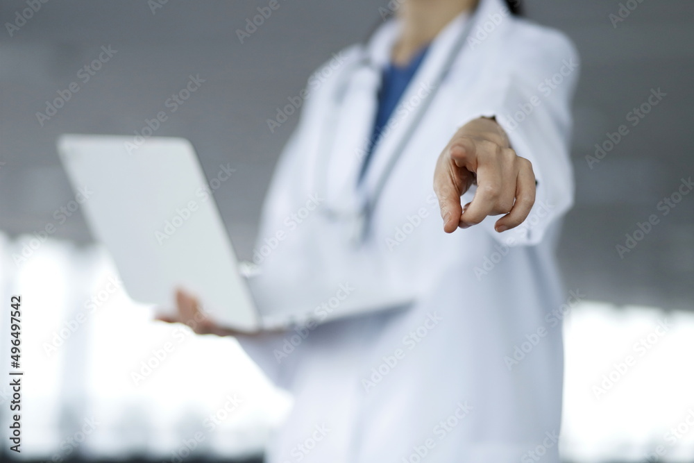 Doctor pointing finger with laptop Doctor pointing finger with laptop