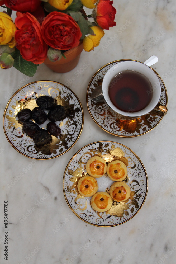 Some Nastar cookies, sweet dates, and a cup of hot tea for Ramadan break fasting.