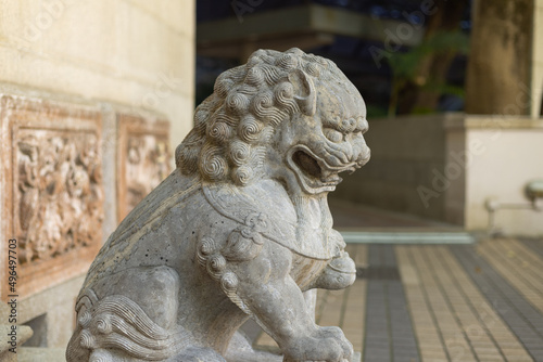Stone Lion statue in front gate of old building in Hong Kong, China