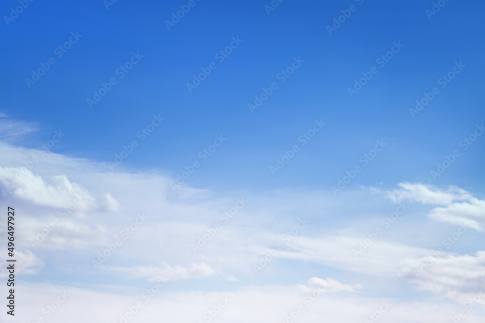 Blue sky with white fluffy cirrus clouds soft focus. Heavenly clouds background summer. Concept of freedom, relaxation, ecology. Copy space. Empty space.