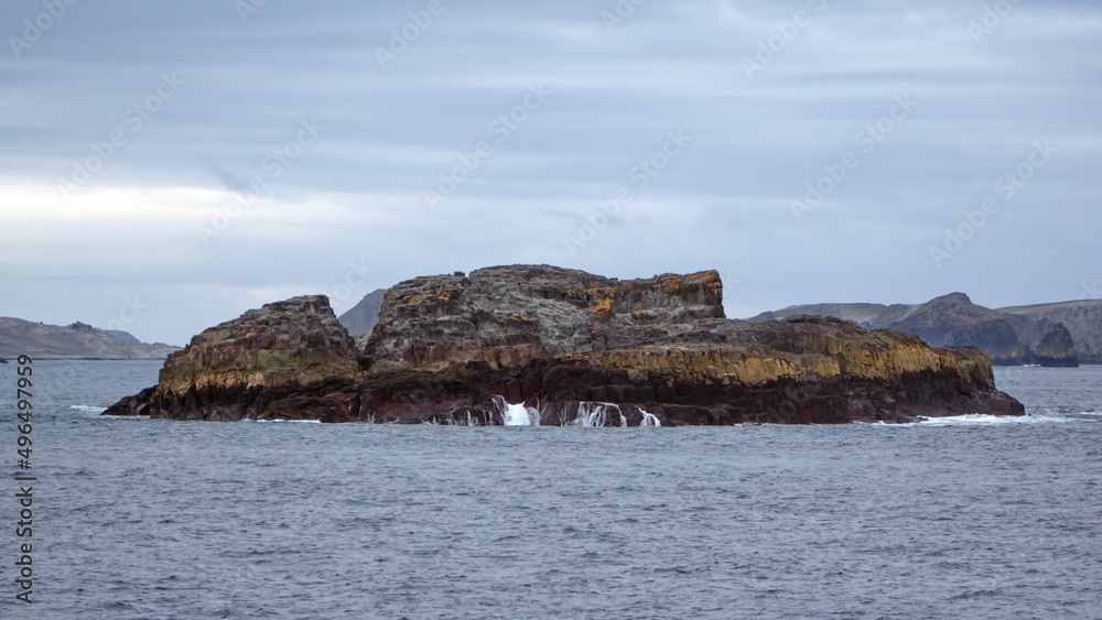 Rocky islet in the Southern Ocean, in Antarctica