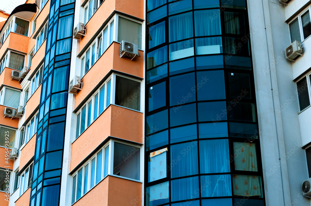 Exterior of a modern multi-story apartment building. Facade, windows and balconies. Exterior of a modern multi-story apartment building. Facade, windows and balconies.