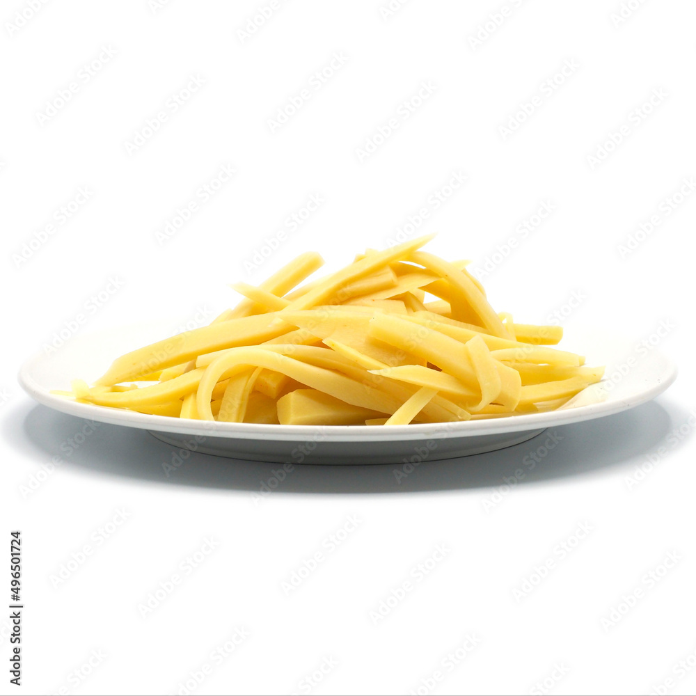 Sliced of bamboo shoots on white dish, isolated on white background. One of the ingredients for Asian cuisines. spot focus