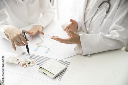 Doctors reviewing medical data in meeting