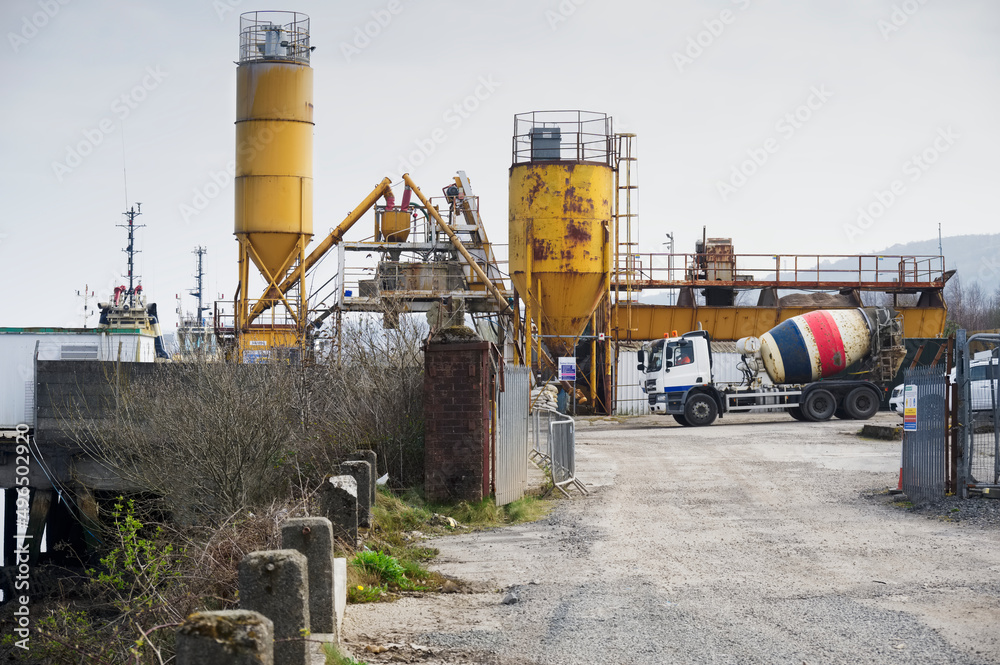 Cement mixing yellow towers and manufacturing site Cement mixing yellow towers and manufacturing site