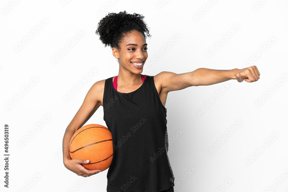 Young basketball player latin woman isolated on white background giving a thumbs up gesture